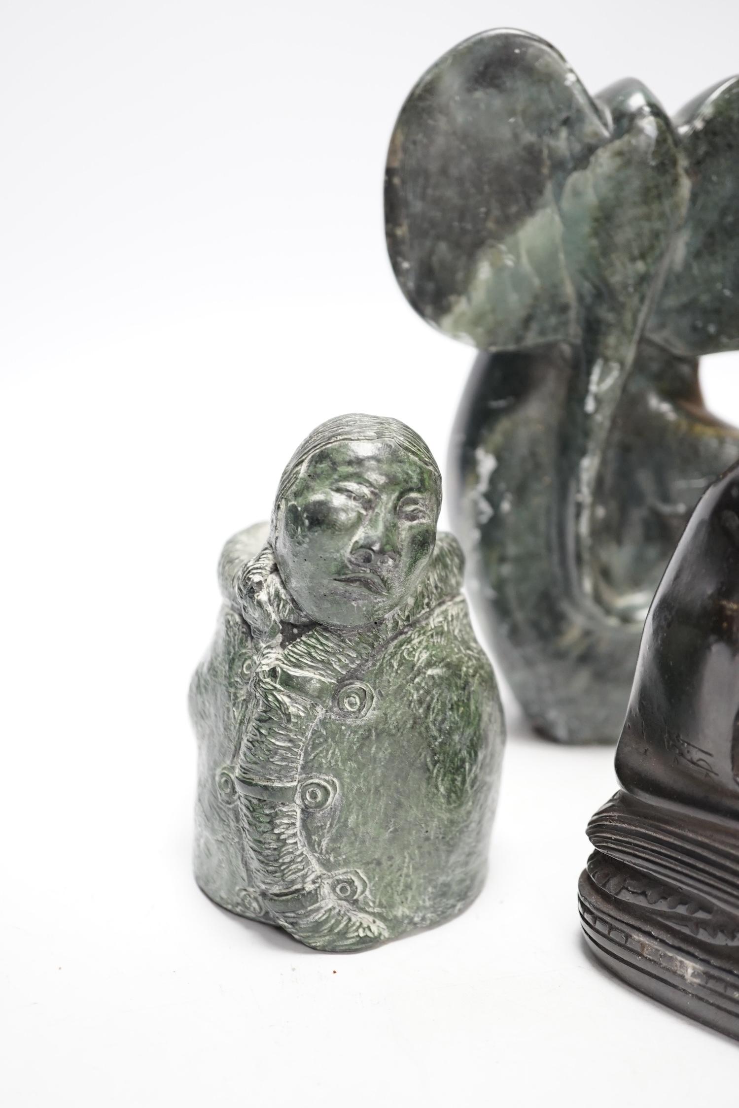 Six soapstone and marble carvings of Inuit figures, elephants, an Egyptian style cat, etc. tallest 22.5cm